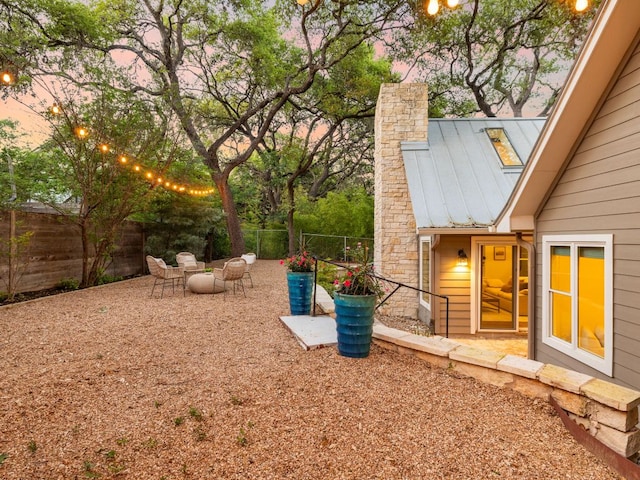 2608 S 2nd St, Austin, TX 78704 - yard at dusk with a fenced backyard and a patio area
