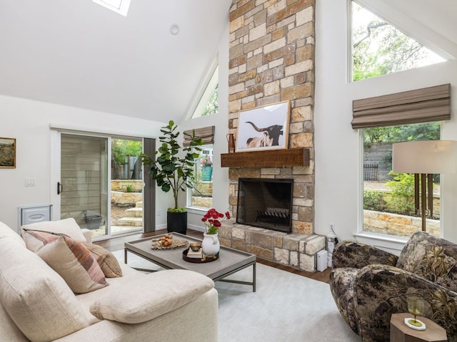 2608 S 2nd St, Austin, TX 78704 - living room with wood finished floors, high vaulted ceiling, and a fireplace