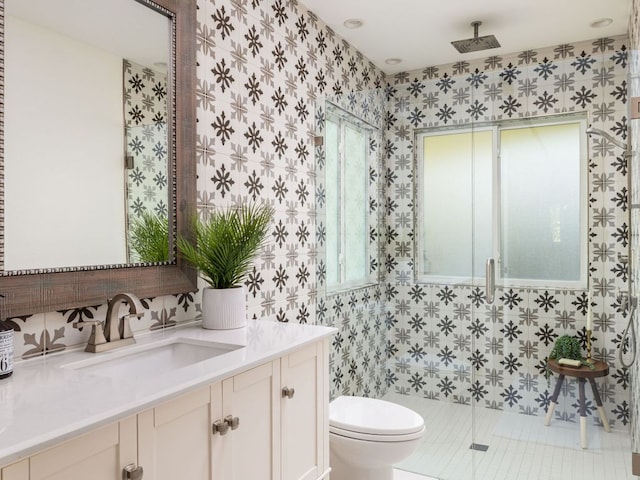 2608 S 2nd St, Austin, TX 78704 - bathroom featuring toilet, healthy amount of natural light, a tile shower, vanity, and tile walls