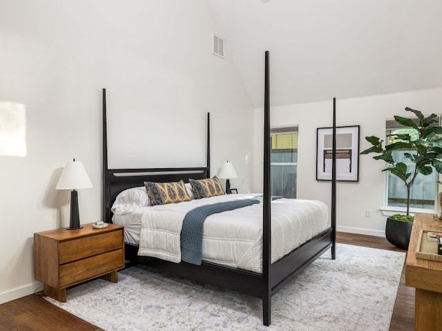 2608 S 2nd St, Austin, TX 78704 - bedroom with wood finished floors, baseboards, and vaulted ceiling