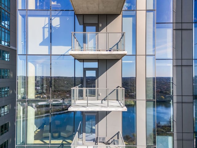 44 E Ave Unit 2301, Austin, TX 78701 - view of swimming pool with a water view and a pool with connected hot tub