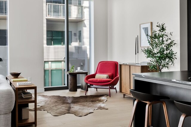 44 E Ave Unit 2301, Austin, TX 78701 - living area featuring light wood finished floors