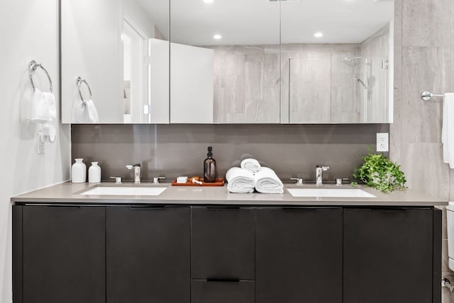44 E Ave Unit 2301, Austin, TX 78701 - bathroom with double vanity, decorative backsplash, and a sink