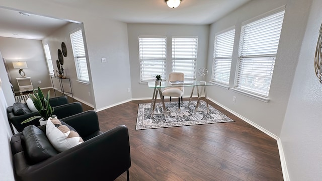 office area with baseboards, wood finished floors, and a wealth of natural light
