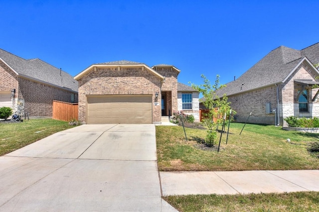 141 Green Knoll Ln, Georgetown, TX 78628 - view of front of property featuring brick siding, an attached garage, a front lawn, and concrete driveway