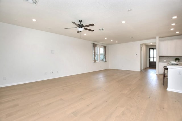 141 Green Knoll Ln, Georgetown, TX 78628 - unfurnished living room featuring recessed lighting, light wood finished floors, and ceiling fan