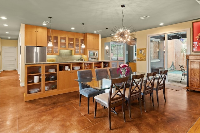 6209 Ledge Mountain Dr, Austin, TX 78731 - dining room featuring recessed lighting, finished concrete floors, and a chandelier