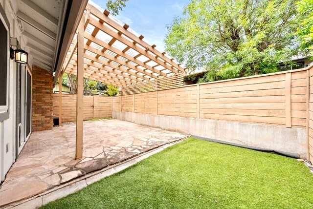 view of yard with a pergola, a patio, and a fenced backyard