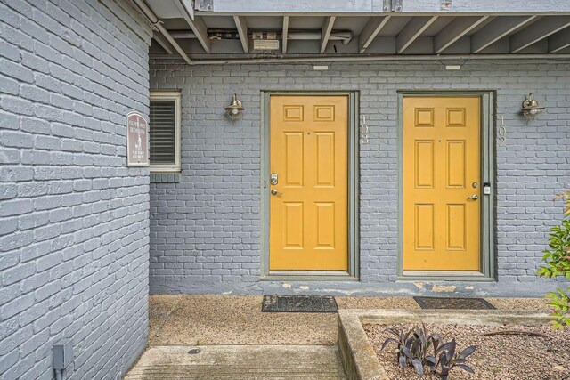 3815 Guadalupe St Unit 103, Austin, TX 78751 - doorway to property featuring brick siding