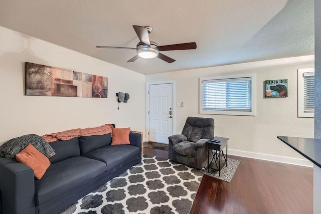 3815 Guadalupe St Unit 103, Austin, TX 78751 - living area with dark wood-style floors, a ceiling fan, and a textured ceiling