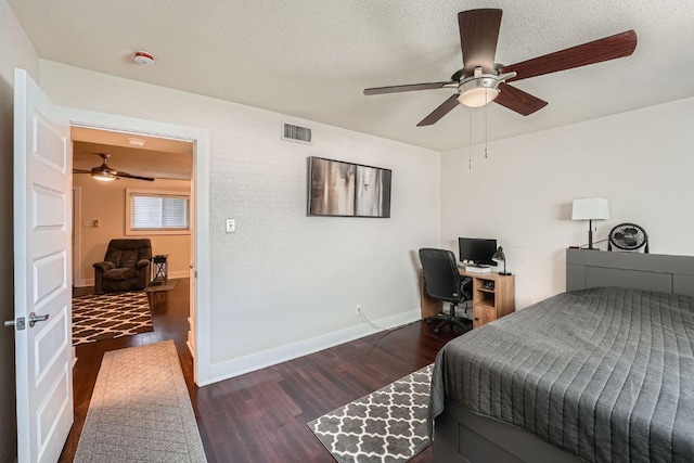 3815 Guadalupe St Unit 103, Austin, TX 78751 - bedroom featuring wood finished floors, a desk, ceiling fan, and a textured ceiling