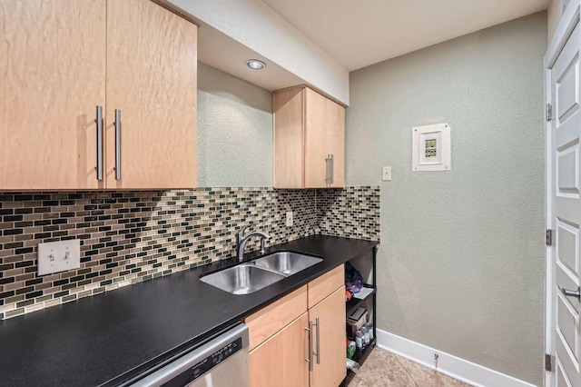 3815 Guadalupe St Unit 103, Austin, TX 78751 - kitchen featuring light brown cabinetry, decorative backsplash, dark countertops, a textured wall, and light tile patterned floors