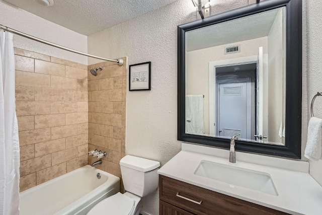 3815 Guadalupe St Unit 103, Austin, TX 78751 - full bath with vanity, a textured wall, shower / bath combo, and a textured ceiling