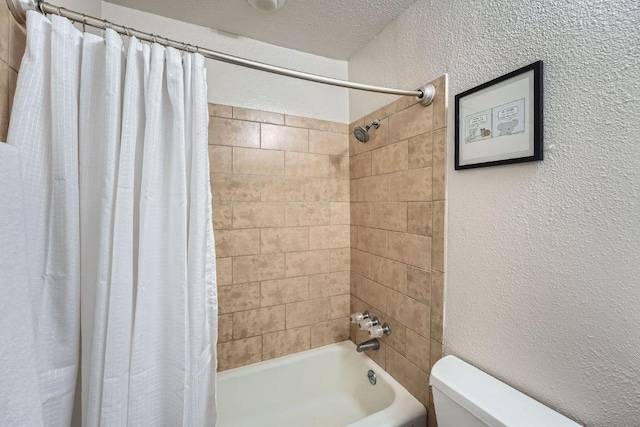 3815 Guadalupe St Unit 103, Austin, TX 78751 - full bath with shower / bath combo, a textured wall, and a textured ceiling