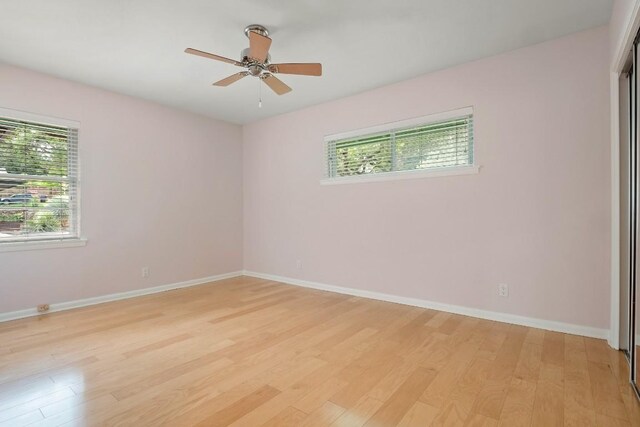 2213 Rebel Rd, Austin, TX 78704 - spare room featuring baseboards, a ceiling fan, and light wood-style floors