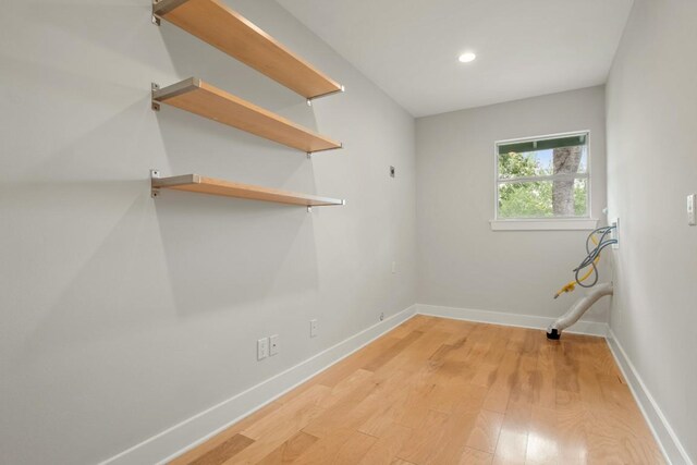 2213 Rebel Rd, Austin, TX 78704 - washroom featuring recessed lighting, light wood-type flooring, baseboards, and laundry area