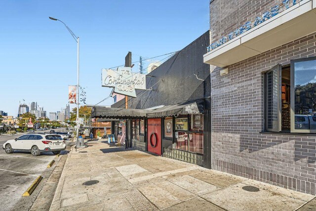 2213 Rebel Rd, Austin, TX 78704 - view of road featuring curbs, a city view, street lighting, and sidewalks