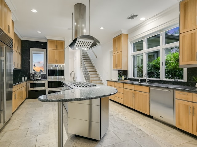 8300 Chalk Knoll Dr, Austin, TX 78735 - kitchen with island exhaust hood, appliances with stainless steel finishes, ornamental molding, decorative backsplash, and recessed lighting