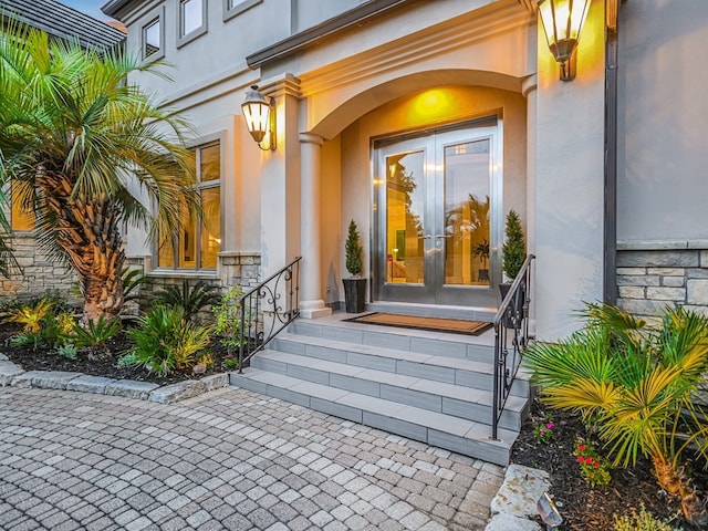 8300 Chalk Knoll Dr, Austin, TX 78735 - doorway to property with french doors, stucco siding, and stone siding