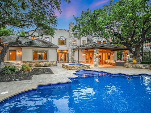8300 Chalk Knoll Dr, Austin, TX 78735 - pool at dusk with a patio, an outdoor living space, and a pool with connected hot tub