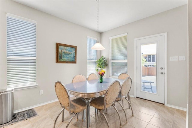 30305 Tiger Woods Dr, Georgetown, TX 78628 - dining room featuring baseboards and light tile patterned flooring