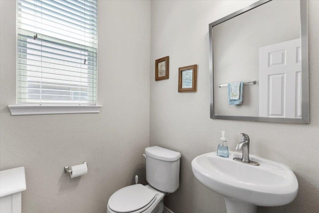 30305 Tiger Woods Dr, Georgetown, TX 78628 - half bathroom featuring toilet and a sink
