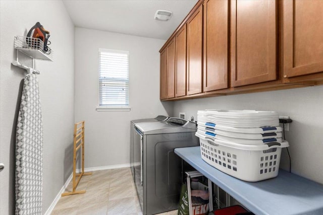 30305 Tiger Woods Dr, Georgetown, TX 78628 - washroom featuring cabinet space, washing machine and dryer, and baseboards