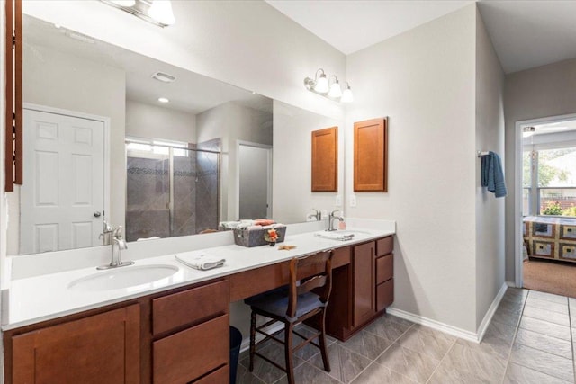 30305 Tiger Woods Dr, Georgetown, TX 78628 - bathroom with double vanity, a stall shower, and baseboards