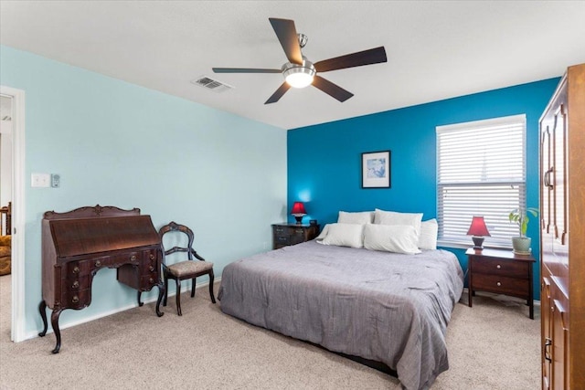 30305 Tiger Woods Dr, Georgetown, TX 78628 - bedroom with light colored carpet and a ceiling fan