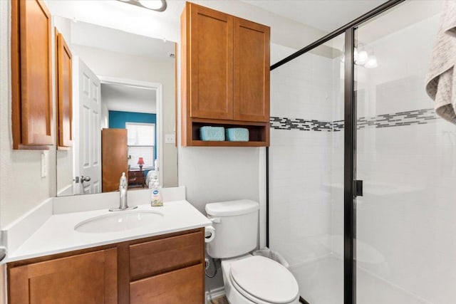 30305 Tiger Woods Dr, Georgetown, TX 78628 - full bathroom featuring vanity, a shower stall, and toilet
