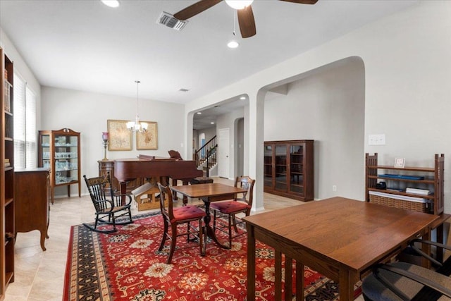 30305 Tiger Woods Dr, Georgetown, TX 78628 - dining room with arched walkways, recessed lighting, a ceiling fan, and a chandelier