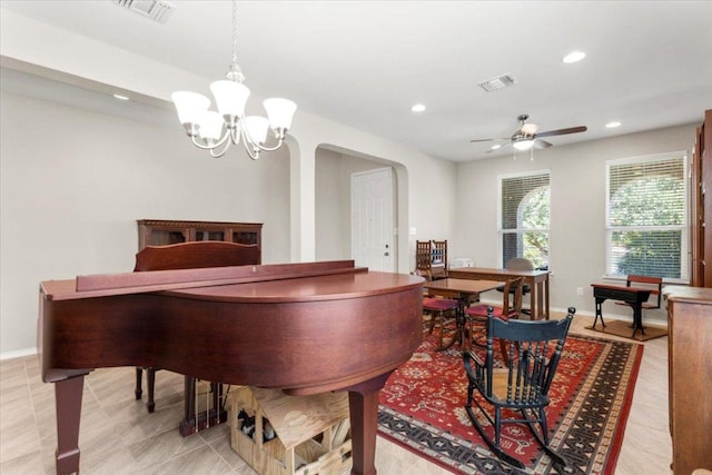 30305 Tiger Woods Dr, Georgetown, TX 78628 - dining space with recessed lighting, arched walkways, baseboards, a chandelier, and ceiling fan