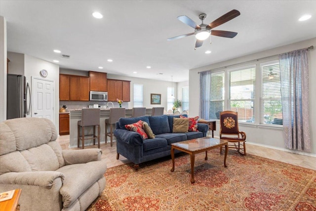 30305 Tiger Woods Dr, Georgetown, TX 78628 - living area featuring recessed lighting, light tile patterned floors, ceiling fan, and baseboards