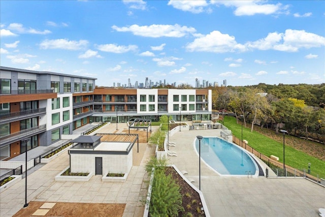 2209 S 1st St Unit 226, Austin, TX 78704 - community pool featuring a skyline view and a patio area