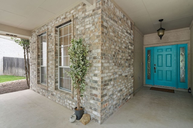 entrance to property featuring a porch