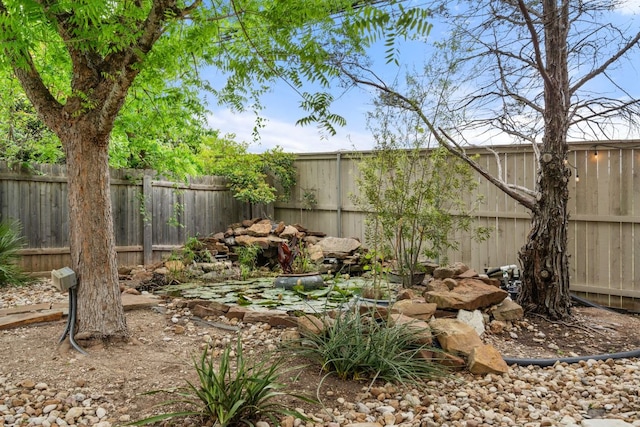 view of yard featuring a fenced backyard