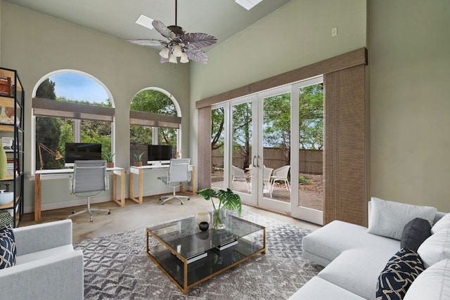 living area with french doors and ceiling fan