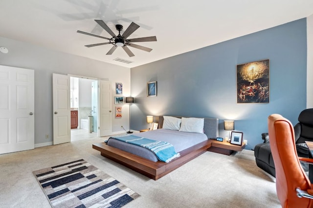 bedroom with ensuite bathroom, ceiling fan, light carpet, baseboards, and visible vents