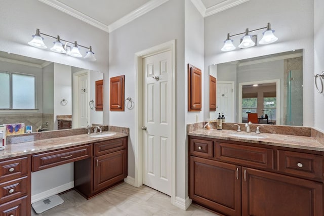 full bath featuring two vanities, a sink, and ornamental molding