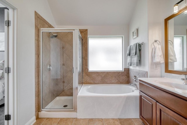 full bath featuring lofted ceiling, a garden tub, vanity, and a shower stall