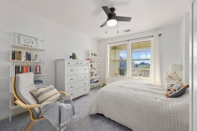 carpeted bedroom featuring visible vents and ceiling fan