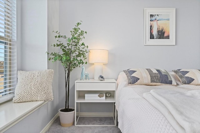 carpeted bedroom with baseboards