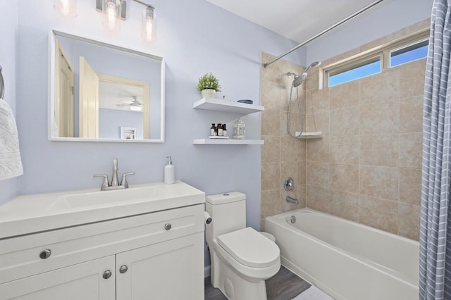 bathroom featuring shower / bath combination with curtain, vanity, and toilet