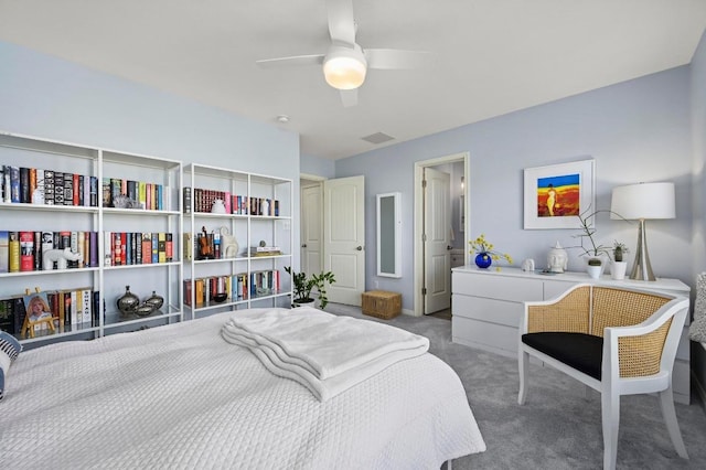 carpeted bedroom with ceiling fan and visible vents