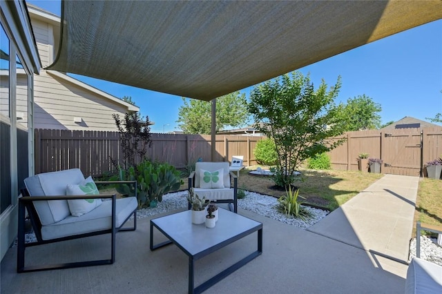 view of patio / terrace featuring a fenced backyard, a gate, and an outdoor hangout area