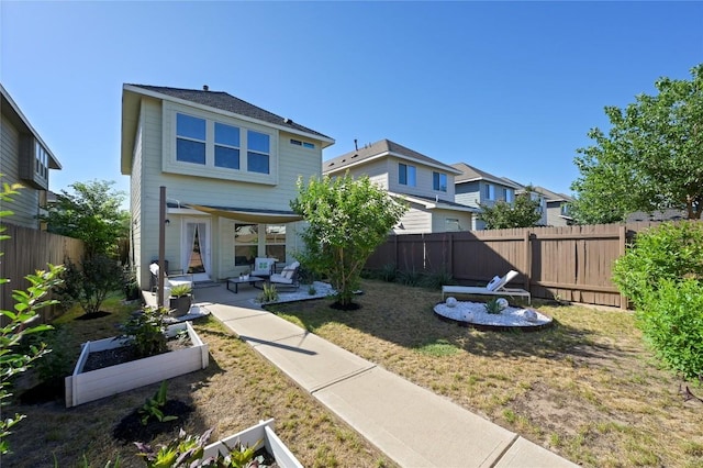 back of house featuring an outdoor living space, a patio area, a fenced backyard, a yard, and a residential view