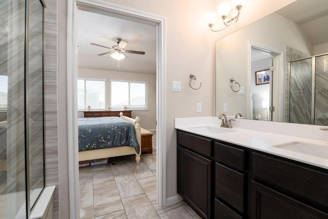 ensuite bathroom featuring ceiling fan, a sink, double vanity, and ensuite bathroom