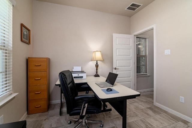 office featuring visible vents and baseboards