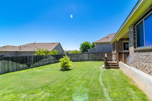 view of yard with a fenced backyard