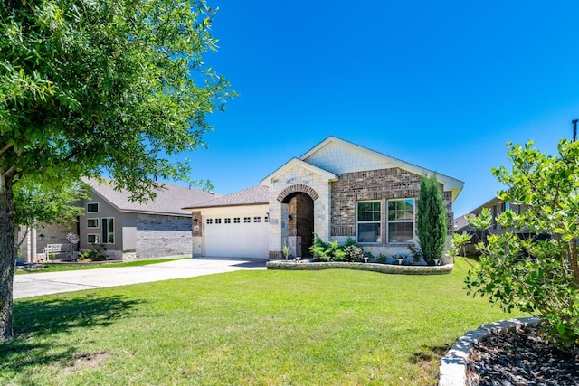 single story home featuring stone siding, driveway, a front yard, and a garage